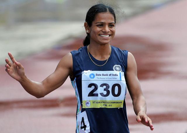 Dutee Chand waves to the crowd after winning a bronze in the women's 200 meters race at the Asian Athletics Championship 2013 at the Chatrapati Shivaji Stadium in Pune. (AFP file photo)
