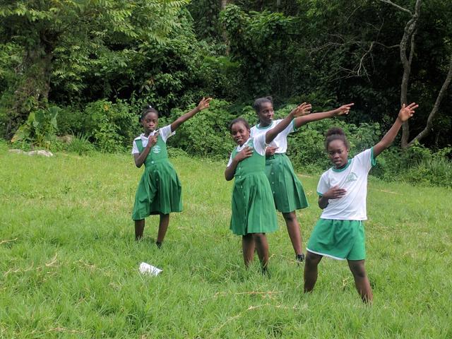 Kids enacting Usain Bolt’s signature pose at his village in Jamaica. (HT Photo) Kids enacting Usain Bolt’s signature pose at his village in Jamaica. (HT Photo)