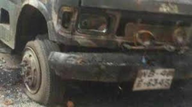 A police vehicle torched outside Baduria police station in North 24 Parganas district on Monday night. (HT Photo)