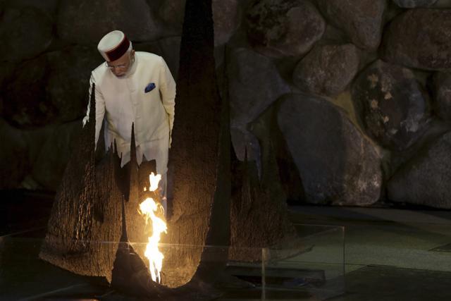 Indian Prime Minister Narendra Modi rekindles the 'Eternal Flame' during a memorial ceremony at the Yad Vashem Holocaust memorial museum in Jerusalem, Israel. (AP) Indian Prime Minister Narendra Modi rekindles the 'Eternal Flame' during a memorial ceremony at the Yad Vashem Holocaust memorial museum in Jerusalem, Israel. (AP)