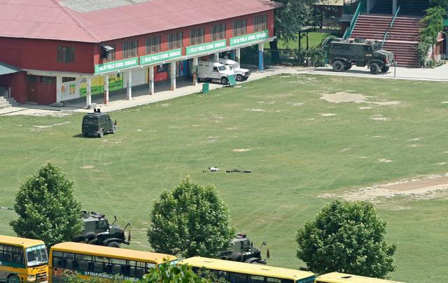Bullet proof vehicles stationed in the premises of Delhi Public School (DPS) where two militants were holed up during an encounter with the security forces at Pantha Chowk in Srinagar. (PTI File Photo) Bullet proof vehicles stationed in the premises of Delhi Public School (DPS) where two militants were holed up during an encounter with the security forces at Pantha Chowk in Srinagar. (PTI File Photo)