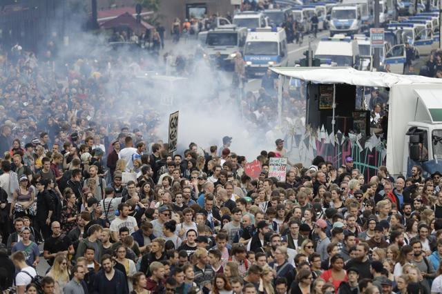 Police cars follow demonstrators during a dancing protest against the G-20 summit in Hamburg. (AP) Police cars follow demonstrators during a dancing protest against the G-20 summit in Hamburg. (AP)