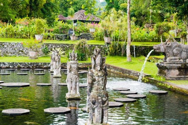 Tirta Gangga, the former royal water palace is a maze of pools and fountains surrounded by a lush garden and stone carvings and statues near Karangasem, Bali. (Shutterstock) Tirta Gangga, the former royal water palace is a maze of pools and fountains surrounded by a lush garden and stone carvings and statues near Karangasem, Bali. (Shutterstock)