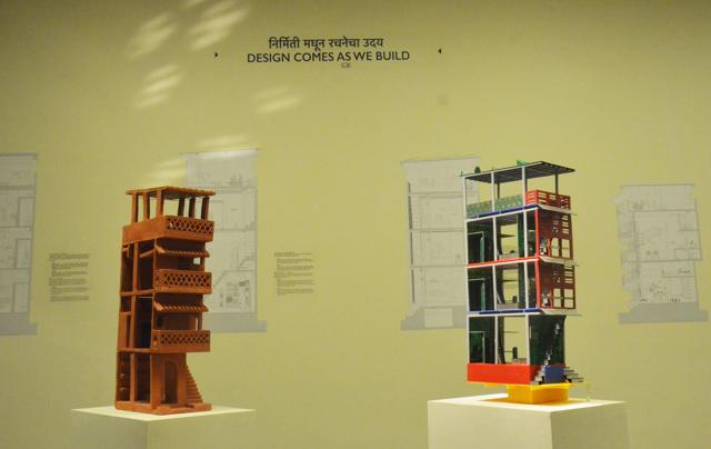 An installation titled ‘Design Comes As We Build’ showcases an architectural model of a typical Mumbai chawl, juxtaposed with a model home with essentially the same structure.