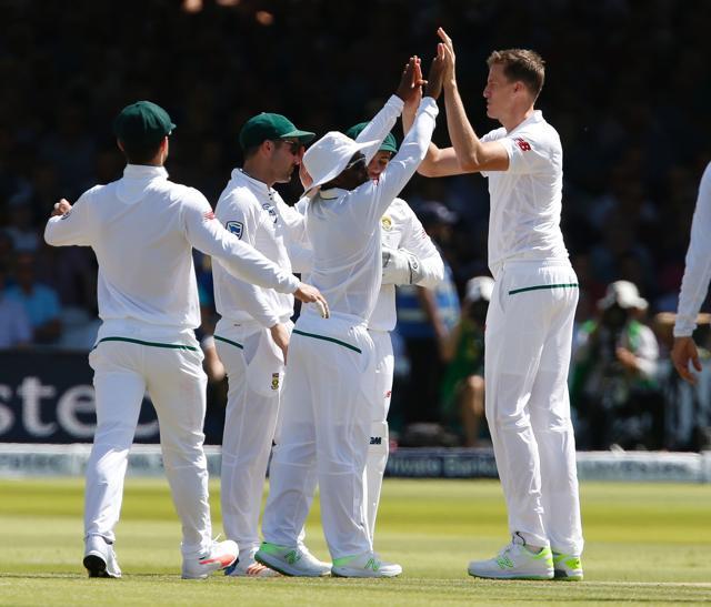 South Africa’s Morne Morkel (R) celebrates taking the wicket of England's Liam Dawson on the second day of the first Test match between England and South Africa at Lord's on Friday. (AFP) South Africa’s Morne Morkel (R) celebrates taking the wicket of England's Liam Dawson on the second day of the first Test match between England and South Africa at Lord's on Friday. (AFP)