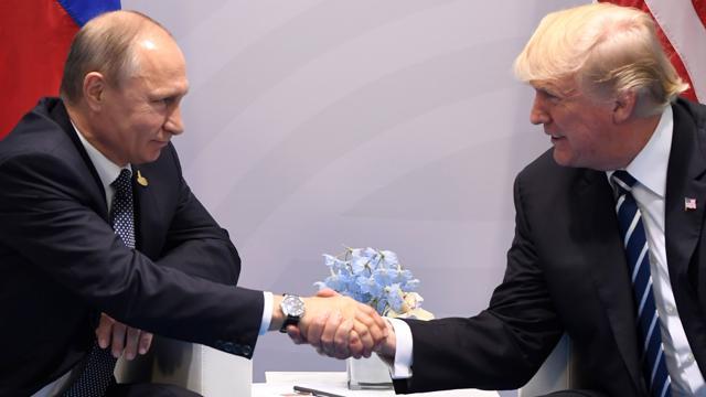 US President Donald Trump and Russia's President Vladimir Putin shake hands during a meeting on the sidelines of the G20 Summit in Hamburg, on July 7, 2017. (AFP) US President Donald Trump and Russia's President Vladimir Putin shake hands during a meeting on the sidelines of the G20 Summit in Hamburg, on July 7, 2017. (AFP)