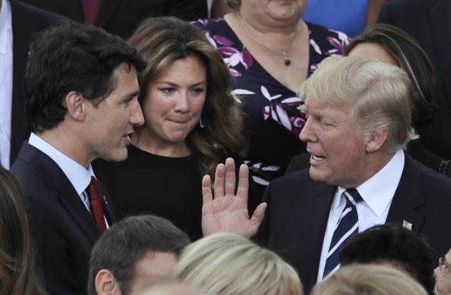 US President Donald Trump talks to Canada's Prime Minister Justin Trudeau and his wife Sophie Gregoire-Trudeau prior to a concert on the first day of the G-20 summit in Hamburg, on July 7, 2017. (AP) US President Donald Trump talks to Canada's Prime Minister Justin Trudeau and his wife Sophie Gregoire-Trudeau prior to a concert on the first day of the G-20 summit in Hamburg, on July 7, 2017. (AP)
