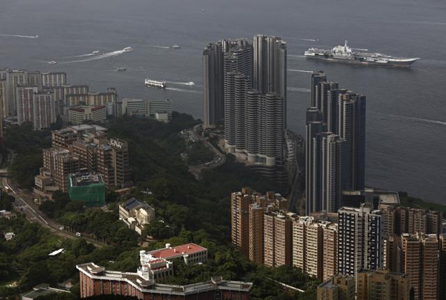 The Liaoning, China's first aircraft carrier, right top, sails into Hong Kong for a port call, Friday, July 7, 2017. (AP) The Liaoning, China's first aircraft carrier, right top, sails into Hong Kong for a port call, Friday, July 7, 2017. (AP)