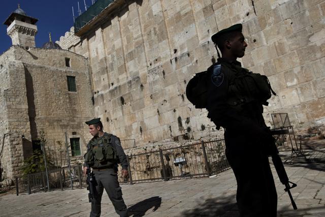 Israeli border police stand guard on the site known to Jews as the Tomb of the Patriarchs, and to Muslims as the Ibrahimi Mosque, in the West Bank city of Hebron. (AP Photo) Israeli border police stand guard on the site known to Jews as the Tomb of the Patriarchs, and to Muslims as the Ibrahimi Mosque, in the West Bank city of Hebron. (AP Photo)
