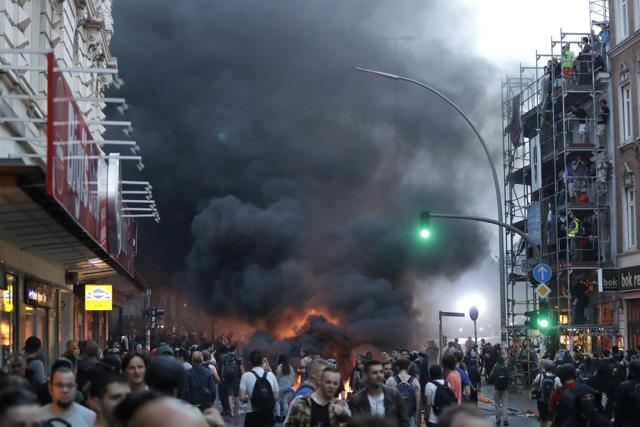 A barricade is set on fire during a protest against the G20 summit in Hamburg. (AP Photo) A barricade is set on fire during a protest against the G20 summit in Hamburg. (AP Photo)