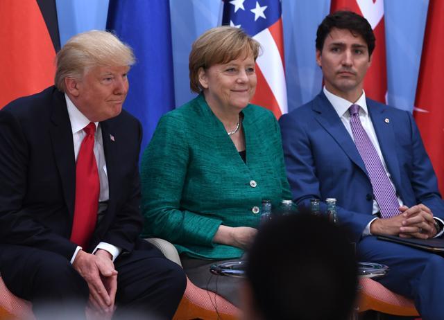 (L-R) US President Donald Trump, German Chancellor Angela Merkel and Canada's Prime Minister Justin Trudeau attend a panel discussion on the second day of the G20 Summit in Hamburg, Germany, July 8, 2017. (AFP) (L-R) US President Donald Trump, German Chancellor Angela Merkel and Canada's Prime Minister Justin Trudeau attend a panel discussion on the second day of the G20 Summit in Hamburg, Germany, July 8, 2017. (AFP)
