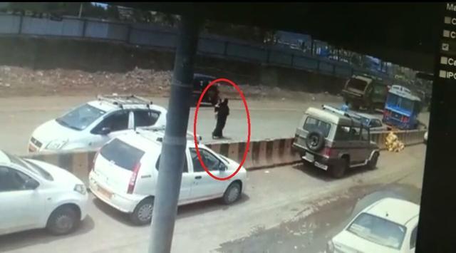 CCTV footage shows a veiled woman carrying a child. CCTV footage shows a veiled woman carrying a child.