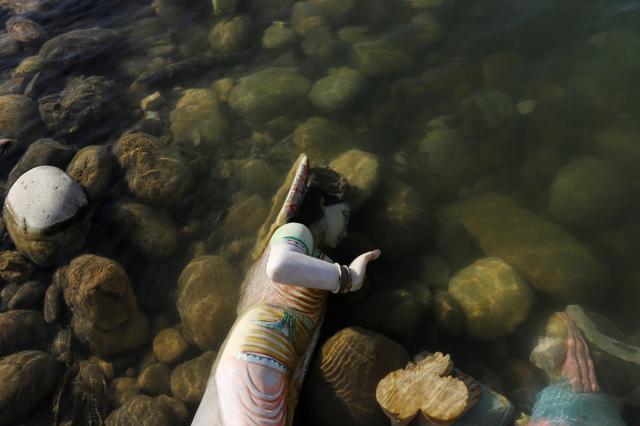 A damaged idol of Hindu goddess Kali is seen in the river Ganga in Haridwar. (REUTERS) A damaged idol of Hindu goddess Kali is seen in the river Ganga in Haridwar. (REUTERS)