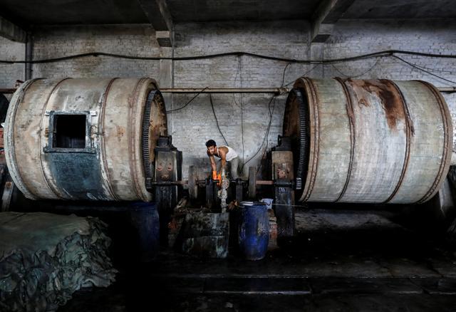 An employee works inside a leather tannery at an industrial area in Kanpur. (REUTERS) An employee works inside a leather tannery at an industrial area in Kanpur. (REUTERS)