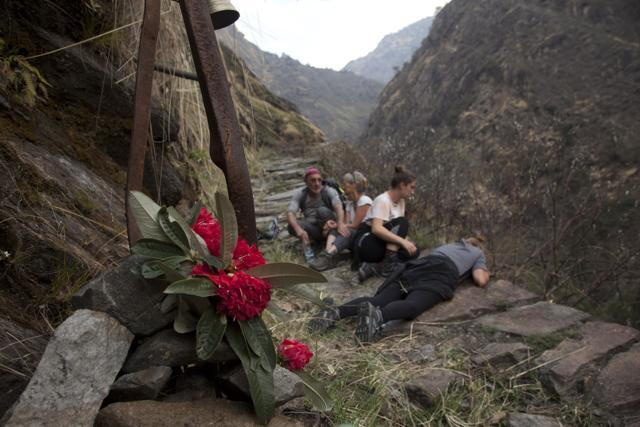 Elizabeth Brenner (3rd R), and her family sit at the spot on the Milam Glacier Trail where Brenner's son, Thomas Plotkin, slipped and fell more than 300 feet down a steep gorge and into the raging Goriganga river in 2011. (Rishabh R. Jain / AP) Elizabeth Brenner (3rd R), and her family sit at the spot on the Milam Glacier Trail where Brenner's son, Thomas Plotkin, slipped and fell more than 300 feet down a steep gorge and into the raging Goriganga river in 2011. (Rishabh R. Jain / AP)