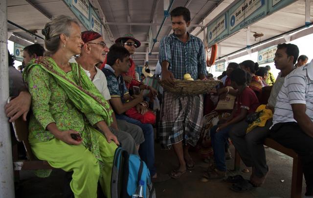 Elizabeth Brenner (L), dressed in green, sits on a crowded steamer boat along with her partner Barry Knight near Gangasagar, West Bengal. Brenner spent two months tracing the 1669 kilometers path along the Ganges River to where it empties into the Bay of Bengal as she believes this is the path taken by her son's remains. (Rishabh R. Jain / AP) Elizabeth Brenner (L), dressed in green, sits on a crowded steamer boat along with her partner Barry Knight near Gangasagar, West Bengal. Brenner spent two months tracing the 1669 kilometers path along the Ganges River to where it empties into the Bay of Bengal as she believes this is the path taken by her son's remains. (Rishabh R. Jain / AP)