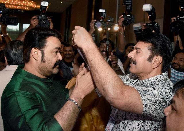 Actors Mammootty (R) and Mohanlal at the annual general body meeting of the Association of Malayalam Movie Artistes in Kochi on Thursday. (PTI)