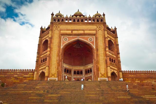 People climb the steps of the Buland Darwaza in Fatehpur Sikri, a UNESCO World Heritage site and considered the first planned city built by the Mughals in India. (Shutterstock) People climb the steps of the Buland Darwaza in Fatehpur Sikri, a UNESCO World Heritage site and considered the first planned city built by the Mughals in India. (Shutterstock)