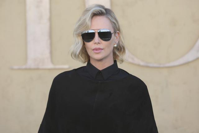 Charlize Theron arrives at the Dior Cruise Show at the Upper Las Virgenes Canyon Open Space Preserve. (Willy Sanjuan/Invision/AP)