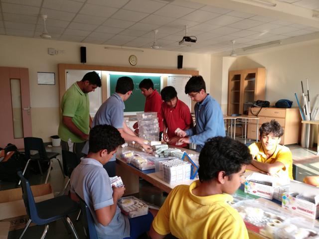 Volunteers arrange first-aid kits for the distribution drive. Volunteers arrange first-aid kits for the distribution drive.