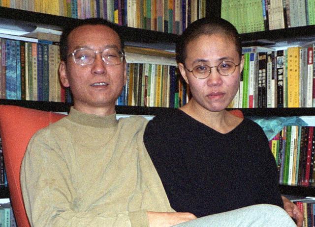 This file handout photo released by the Liu's family and taken on October 22, 2002 shows Chinese dissident and Nobel Peace laureate Liu Xiaobo (L) and his wife Liu Xia in Beijing. China's cancer-stricken Nobel laureate Xiaobo died on July 13, 2017, aged 61, official said. (AFP PHOTO / LIU FAMILY HANDOUT)