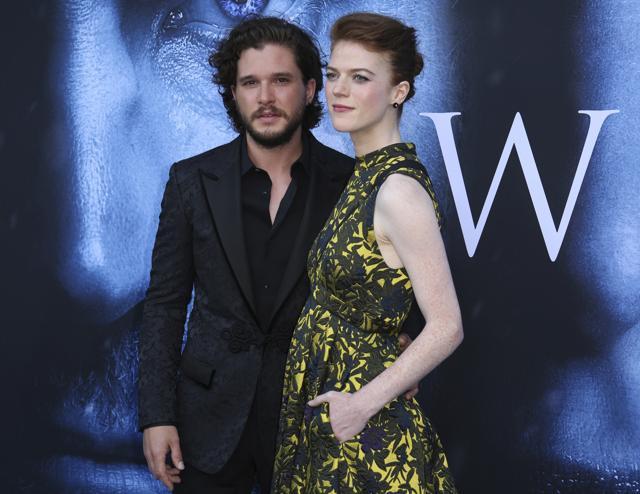 Kit Harington, left, and Rose Leslie, a real-life couple who played lovers in the show, arrive at the LA Premiere of Game of Thrones. (Willy Sanjuan/Invision/AP)