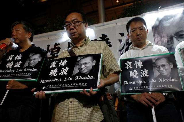Pro-democracy activists mourn the death of Chinese Nobel Peace laureate Liu Xiaobo outside China's Liaison Office in Hong Kong on July 13, 2017. (Reuters) Pro-democracy activists mourn the death of Chinese Nobel Peace laureate Liu Xiaobo outside China's Liaison Office in Hong Kong on July 13, 2017. (Reuters)