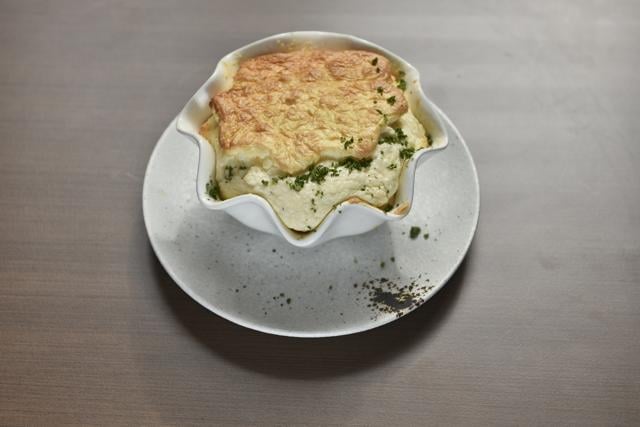 Kode’s baked camembert soufflé is a timeless classic, with its light-as-air cheesy goodness enhanced by a generous pour of béchamel. (Aalok Soni / HT Photo)
