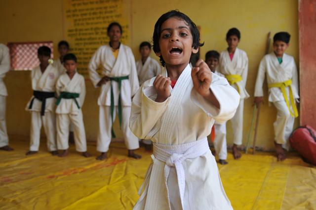 Shreya Tiwari, 7, a Class 3 student in Harda, wants to be “a fighter” when she grows up. She practices judo every day with three classmates. (Mujeeb Faruqui / HT Photo)