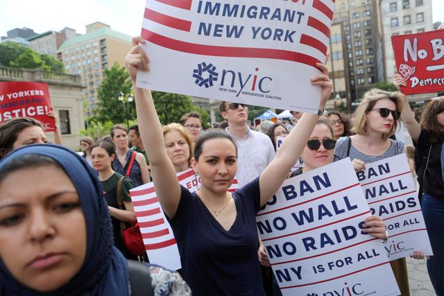 Protesters hold signs against U. President Donald Trump's limited travel ban, approved by the US Supreme Court, in New York City on June 29, 2017. (Reuters File Photo) Protesters hold signs against U. President Donald Trump's limited travel ban, approved by the US Supreme Court, in New York City on June 29, 2017. (Reuters File Photo)