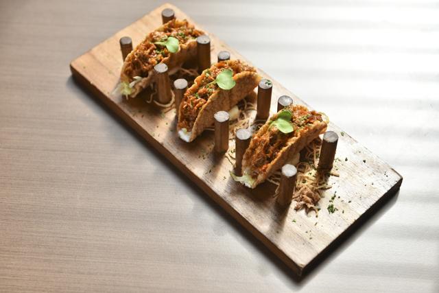 The crunchy lamb and cilantro taco was suitably straightforward, if a tad pedestrian and lacking in oomph. (Aalok Soni / HT Photo)
