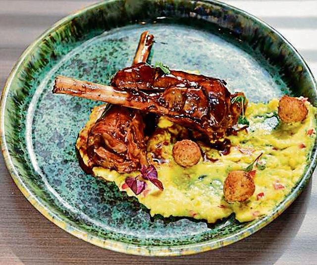 The slow-cooked lamb shanks with blue cheese and black truffle polenta and red wine jus had us mopping the dish clean with warm potato bread. (Aalok Soni / HT Photo)