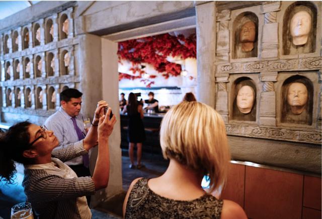 People take photos of The Hall of Faces at the pop-up bar. Further ahead, spread across the ceiling, are the mighty white branches and red leaves of the sacred Weirwood tree of Winterfell. (Mandel Ngan/AFP) People take photos of The Hall of Faces at the pop-up bar. Further ahead, spread across the ceiling, are the mighty white branches and red leaves of the sacred Weirwood tree of Winterfell. (Mandel Ngan/AFP)