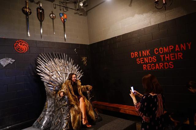 A woman poses for a photo on the Iron Throne. (Mandel Ngan/AFP) A woman poses for a photo on the Iron Throne. (Mandel Ngan/AFP)