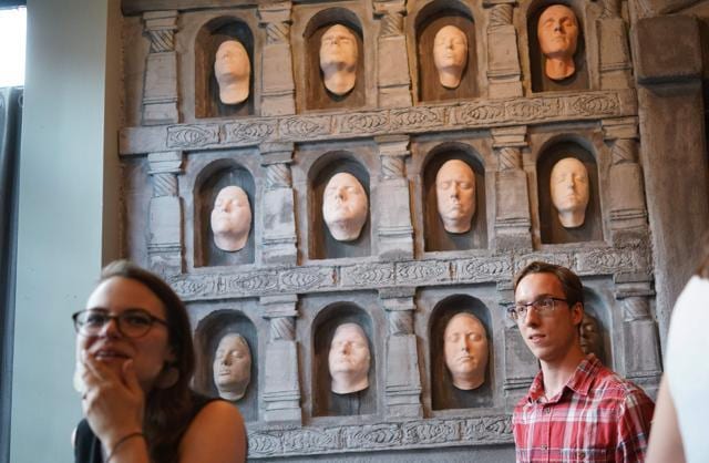 People pose in front of The Hall of Faces. (Mandel Ngan/AFP) People pose in front of The Hall of Faces. (Mandel Ngan/AFP)