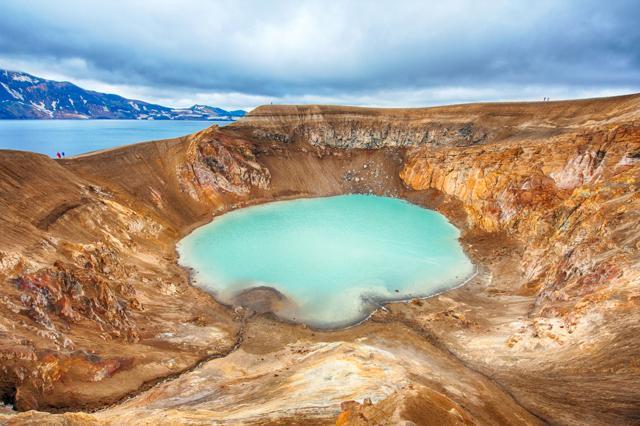 Giant volcano Askja offers a view at two crater lakes. The smaller, turquoise one is called Viti and contains warm geothermal water. The large lake is Oskjuvatn, the second deepest lake in Iceland. (Shutterstock) Giant volcano Askja offers a view at two crater lakes. The smaller, turquoise one is called Viti and contains warm geothermal water. The large lake is Oskjuvatn, the second deepest lake in Iceland. (Shutterstock)