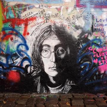 The Lennon Wall in Prague, Czech Republic, is covered with John Lennon-inspired graffiti and pieces of lyrics from Beatles songs. (Shutterstock)