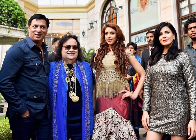 Madhur Bhandarkar, Bappi Lahri along with actors Kirti Kulhari and Ishika Taneja during a song launch for Indu Sarkar. (PTI) Madhur Bhandarkar, Bappi Lahri along with actors Kirti Kulhari and Ishika Taneja during a song launch for Indu Sarkar. (PTI)