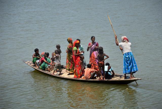 People use boats to reach a makeshift camp at Goroimari village in Kamrup district, Assam. (PTI Photo) People use boats to reach a makeshift camp at Goroimari village in Kamrup district, Assam. (PTI Photo)