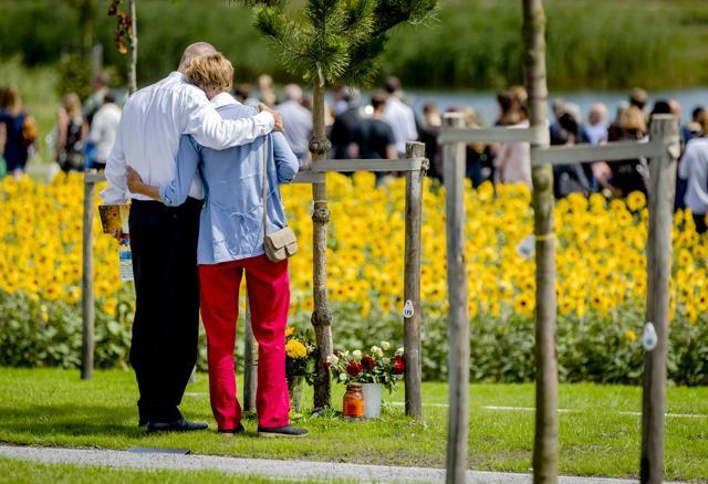 Relatives embrace during the revealing of the National Monument for the MH17 victims in Vijfhuizen, The Netherlands, July 17, 2017. (AP) Relatives embrace during the revealing of the National Monument for the MH17 victims in Vijfhuizen, The Netherlands, July 17, 2017. (AP)