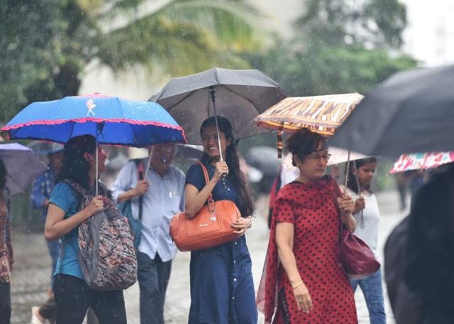 Why should rain take away the cheer? (Satyabrata Tripathy/HT) Why should rain take away the cheer? (Satyabrata Tripathy/HT)