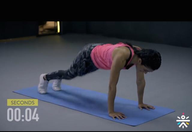 Begin in plank position, with your shoulders over your wrists. (cure.fit ) Begin in plank position, with your shoulders over your wrists. (cure.fit )