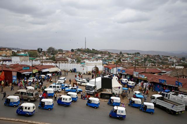 People drive tuk-tuks outside of the walled city of Harar. 16th century Emir Nur Ibn Mujahid built a four-meter-high protective wall around the city, which rising population has breached, creating a need for protection against wild hyenas. (REUTERS) People drive tuk-tuks outside of the walled city of Harar. 16th century Emir Nur Ibn Mujahid built a four-meter-high protective wall around the city, which rising population has breached, creating a need for protection against wild hyenas. (REUTERS)
