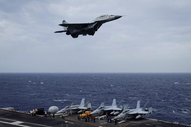 Indian Air Force's MIG-29K Fulcrum flies over US Navy ship Nimitz as part of the tri-nation Malabar 2017 exercise in Bay of Bengal near Chennai coast on Monday. (PTI) Indian Air Force's MIG-29K Fulcrum flies over US Navy ship Nimitz as part of the tri-nation Malabar 2017 exercise in Bay of Bengal near Chennai coast on Monday. (PTI)