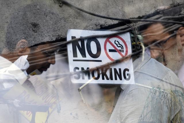 A man smokes a cigarette ahead of the 'World No Tobacco Day at Elphinston road in Mumbai. (Pratik Chorge/HT Photo)