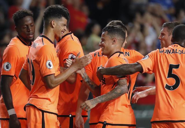 Dominic Solanke of Liverpool FC, left, celebrates with his teammate Philippe Coutinho. (AP) Dominic Solanke of Liverpool FC, left, celebrates with his teammate Philippe Coutinho. (AP)
