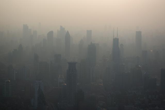 This March 28, 2016 file photo shows the skyline of Shanghai on a polluted day. The US exit from the Paris climate pact is a gift to China's ambitions to become world leader on everything from trade to global warming, despite its own mixed record. (AFP File Photo) This March 28, 2016 file photo shows the skyline of Shanghai on a polluted day. The US exit from the Paris climate pact is a gift to China's ambitions to become world leader on everything from trade to global warming, despite its own mixed record. (AFP File Photo)