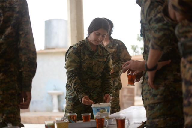 A Yazidi female of Sinjar Resistance Units (YBS) drinks tea at Sinjar mountain, Iraq June 6, 2017. (REUTERS) A Yazidi female of Sinjar Resistance Units (YBS) drinks tea at Sinjar mountain, Iraq June 6, 2017. (REUTERS)