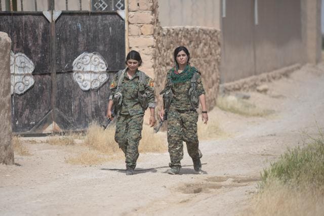 Yazidi females of Sinjar Resistance Units (YBS) carry their weapons at Sinjar mountain, Iraq. (REUTERS) Yazidi females of Sinjar Resistance Units (YBS) carry their weapons at Sinjar mountain, Iraq. (REUTERS)