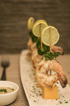 The tangy prawns cooked in amchur and white wine are served tails up on toothpicks poked into cubes of firm cheddar. They’re a bit like the sort of thing a Sindhi ‘aunty’ would serve at a cocktail party, but the seafood is perfectly cooked, treated with the light hand it deserves. (Photo courtesy Fish N Bait) The tangy prawns cooked in amchur and white wine are served tails up on toothpicks poked into cubes of firm cheddar. They’re a bit like the sort of thing a Sindhi ‘aunty’ would serve at a cocktail party, but the seafood is perfectly cooked, treated with the light hand it deserves. (Photo courtesy Fish N Bait)